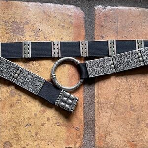 Silver tone segment belt. Loop and hook closure